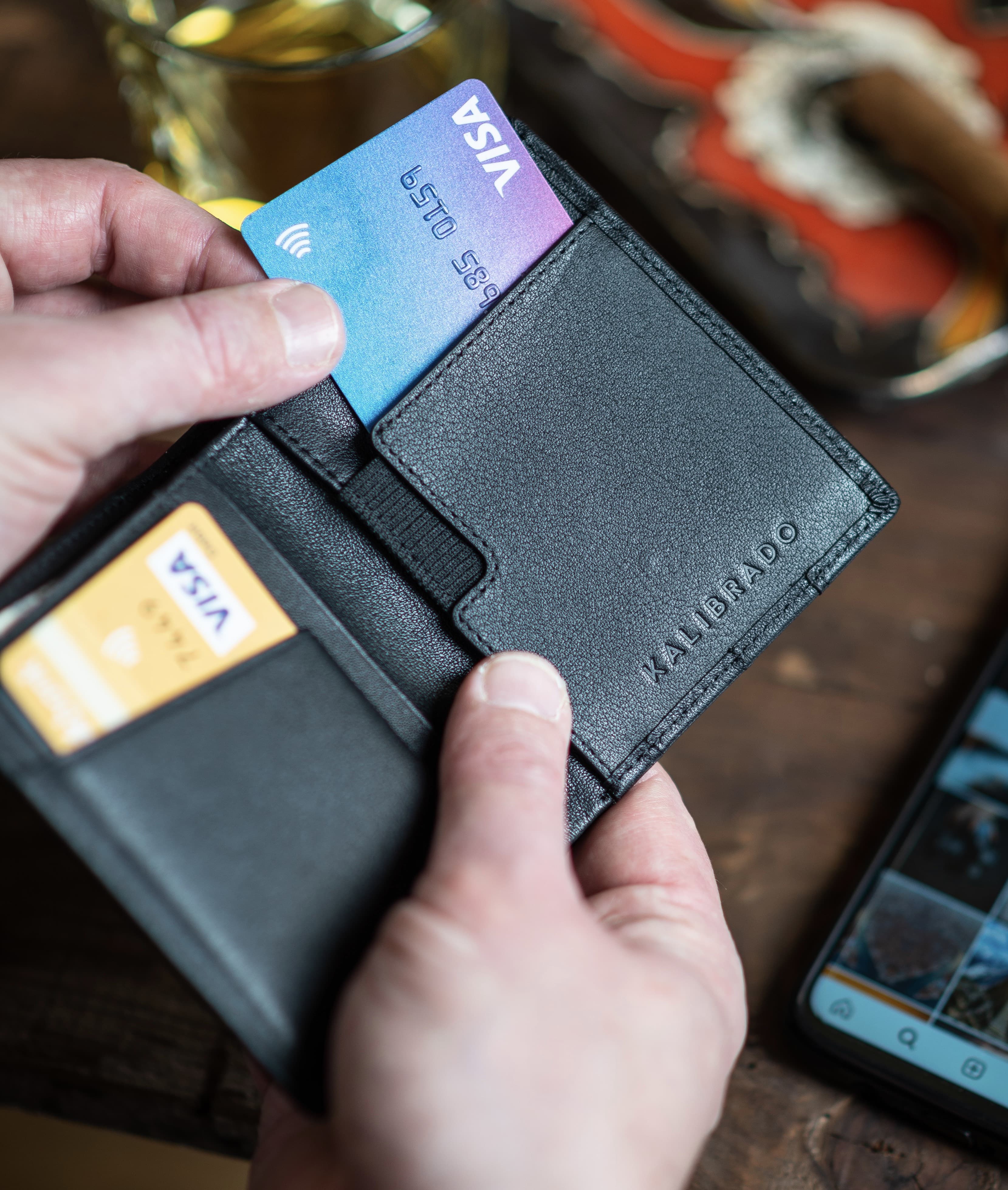 Person taking bank cards from a wallet